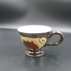 Ceramic art cup, with a tulips design and the colours of red / beige / white / yellow / blue